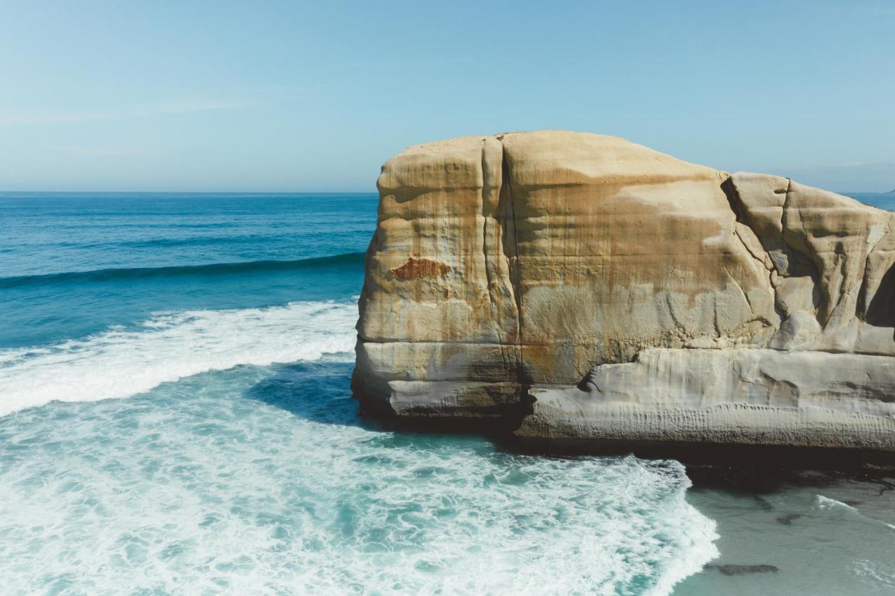 Ebb-Dunedin Exterior photo The rock formation at the beach