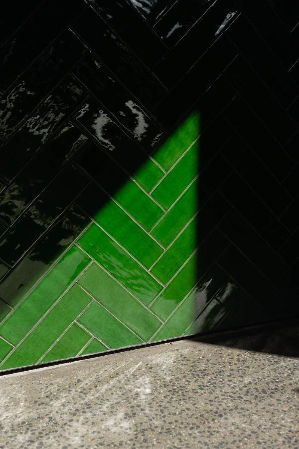 Ebb-Dunedin Exterior photo Subway tiles in a herringbone pattern